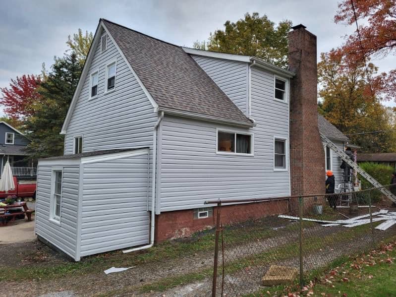 Gray siding with new roof